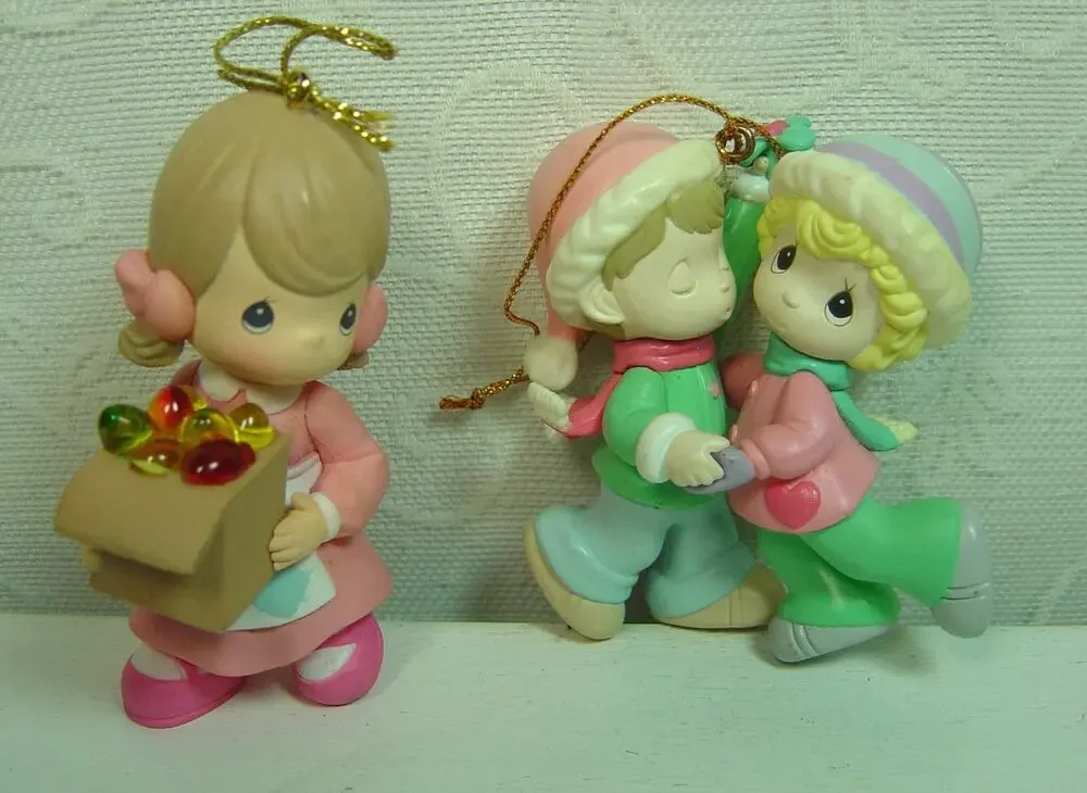 2 PRECIOUS MOMENTS ORNAMENTS-GIRL WITH PACKAGE & BOY/GIRL UNDER THE MISTLETOE